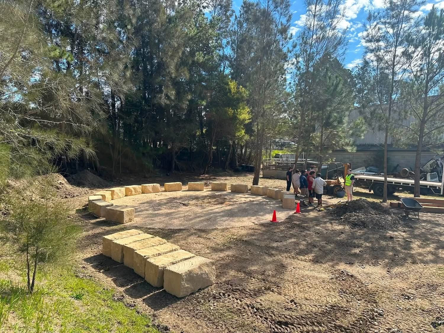Sandstone blocks set out on a cleared site ready for installation